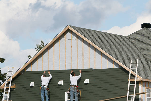 Professional Siding Replacement technician working in Woodland, NC